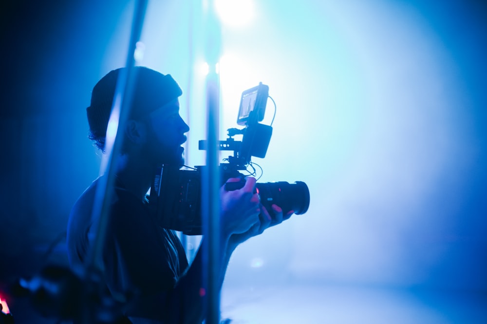 silhouette of person holding camera