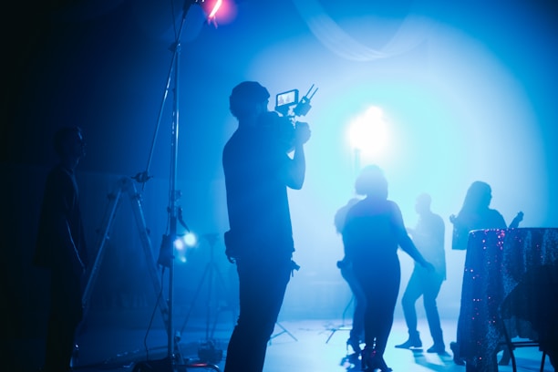 silhouette of people standing on stage