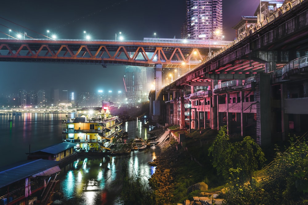 red and brown concrete building near body of water during night time