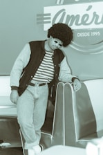 Close-up of colorful 1980s style workout clothes and curly vintage wig on Coach Reynaldo.