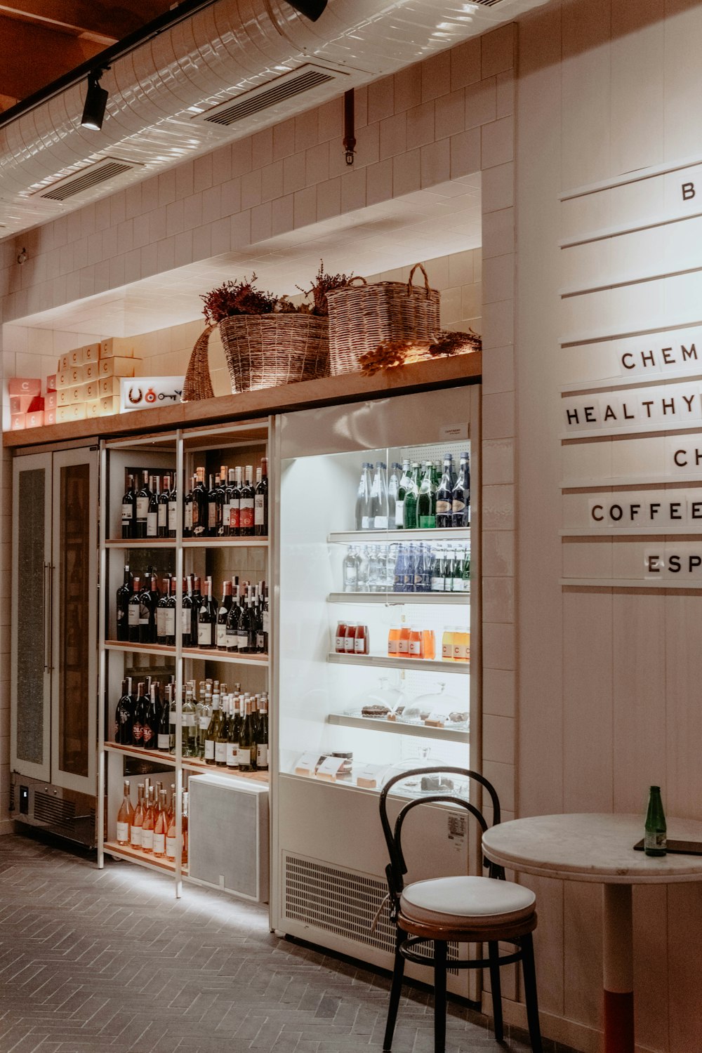 white wooden shelf with bottles and bottles