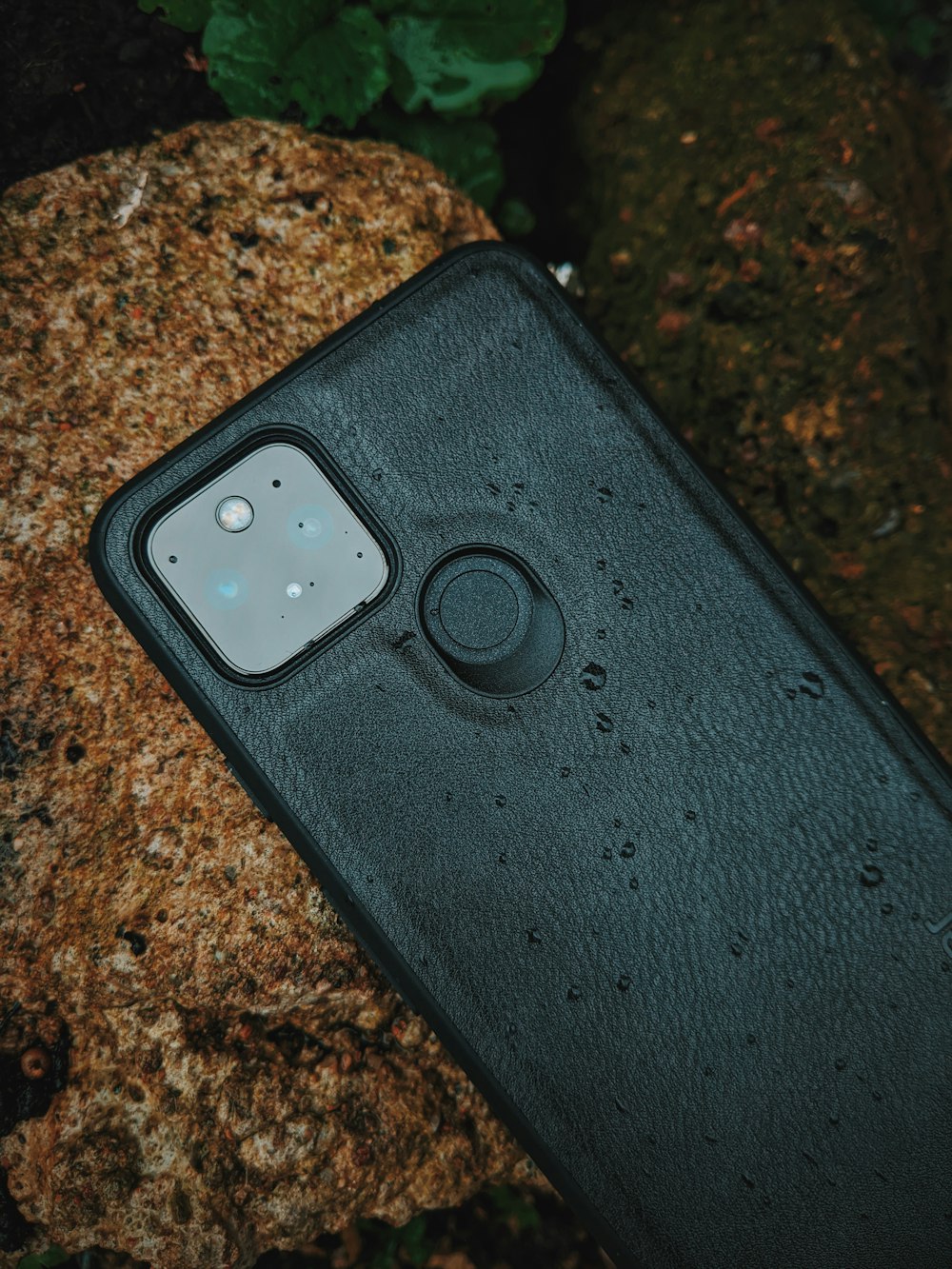 black iphone case on brown marble table