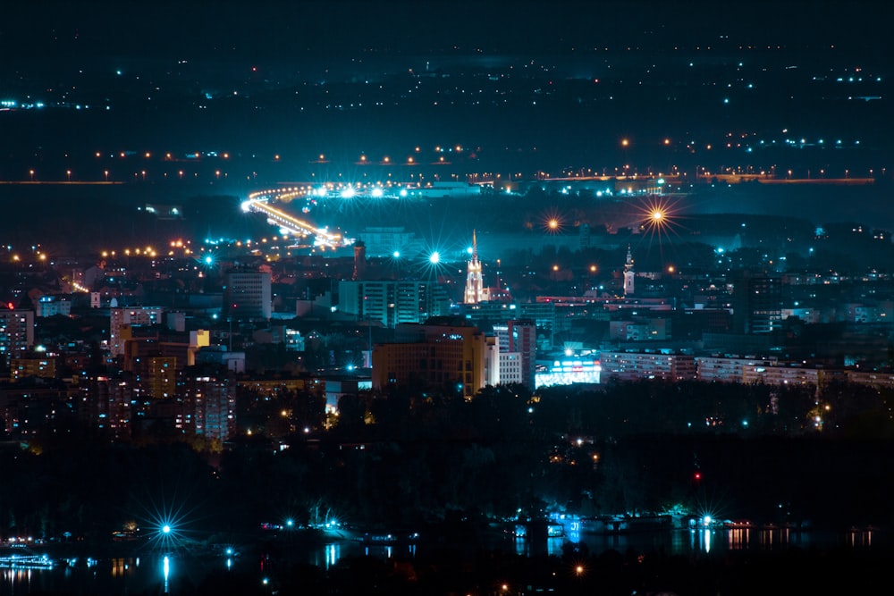 city with high rise buildings during night time