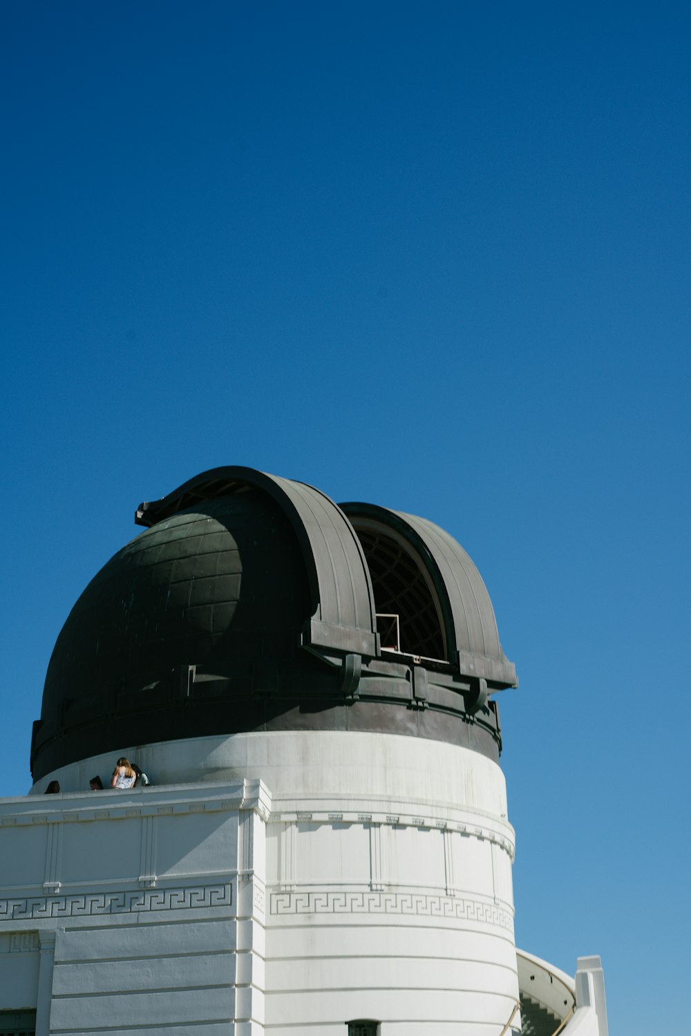 white and black round building