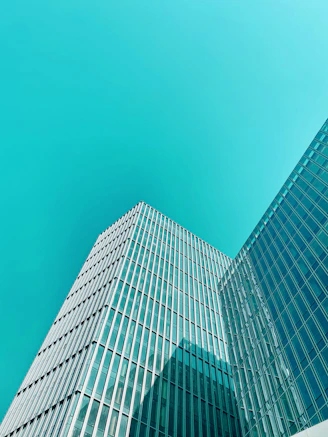 blue glass walled high rise building