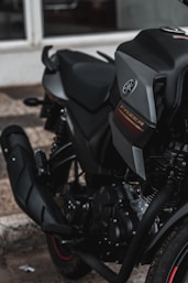 black and gray motorcycle on brown sand during daytime