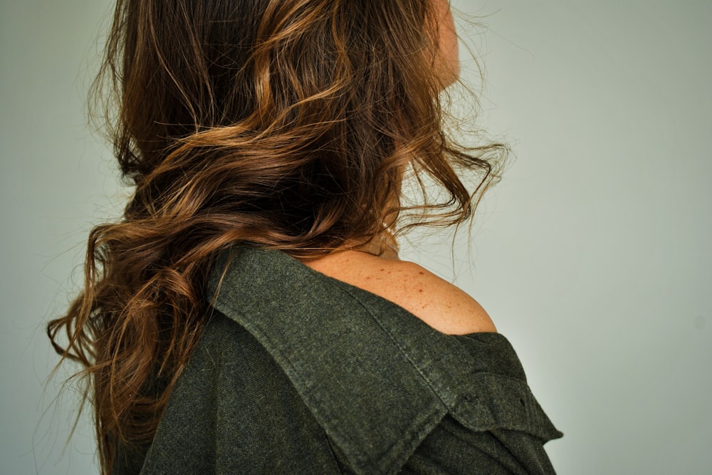 woman in black shirt with brown hair