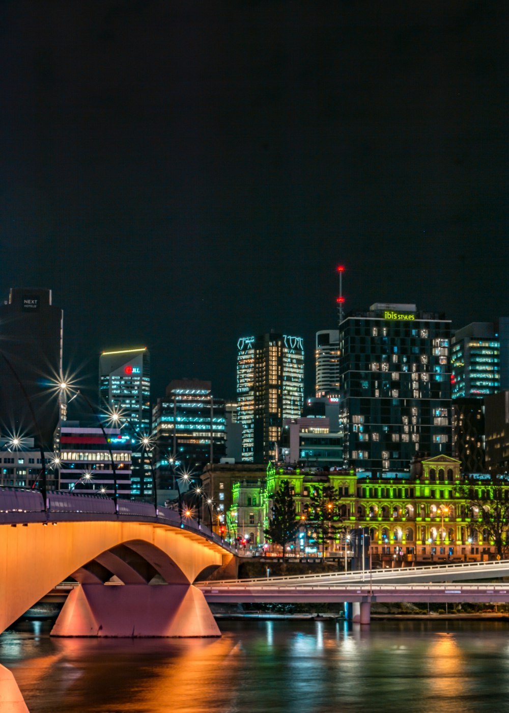 city with high rise buildings during night time