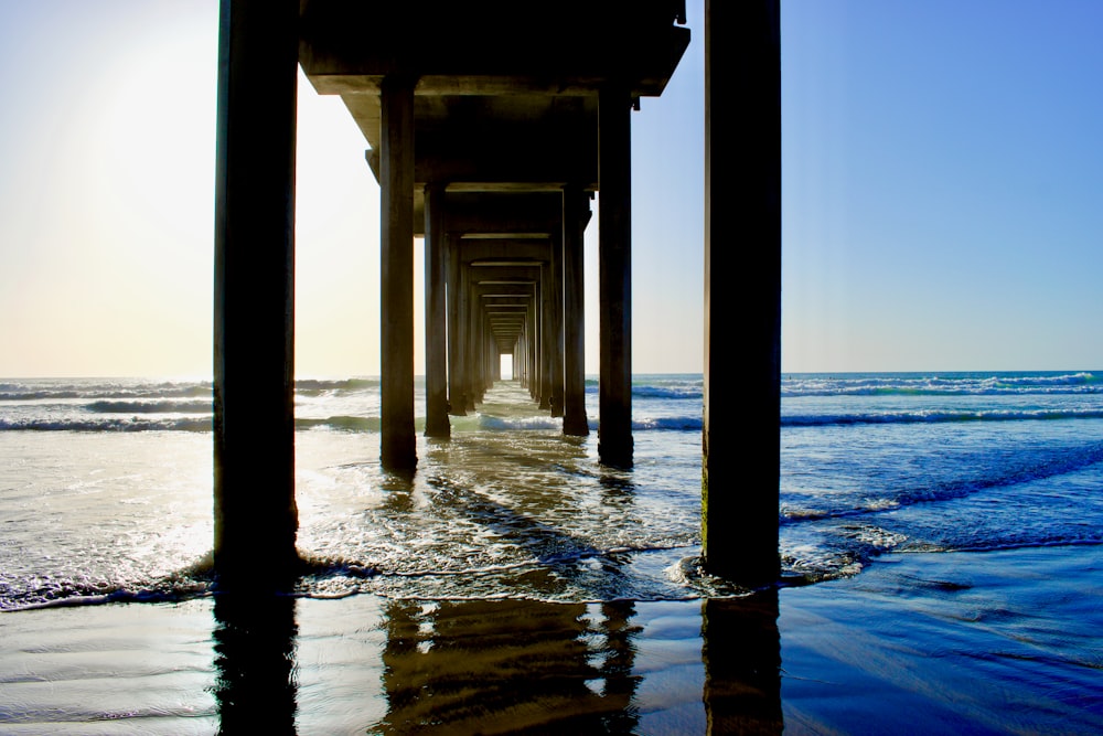 brown wooden dock on sea during daytime