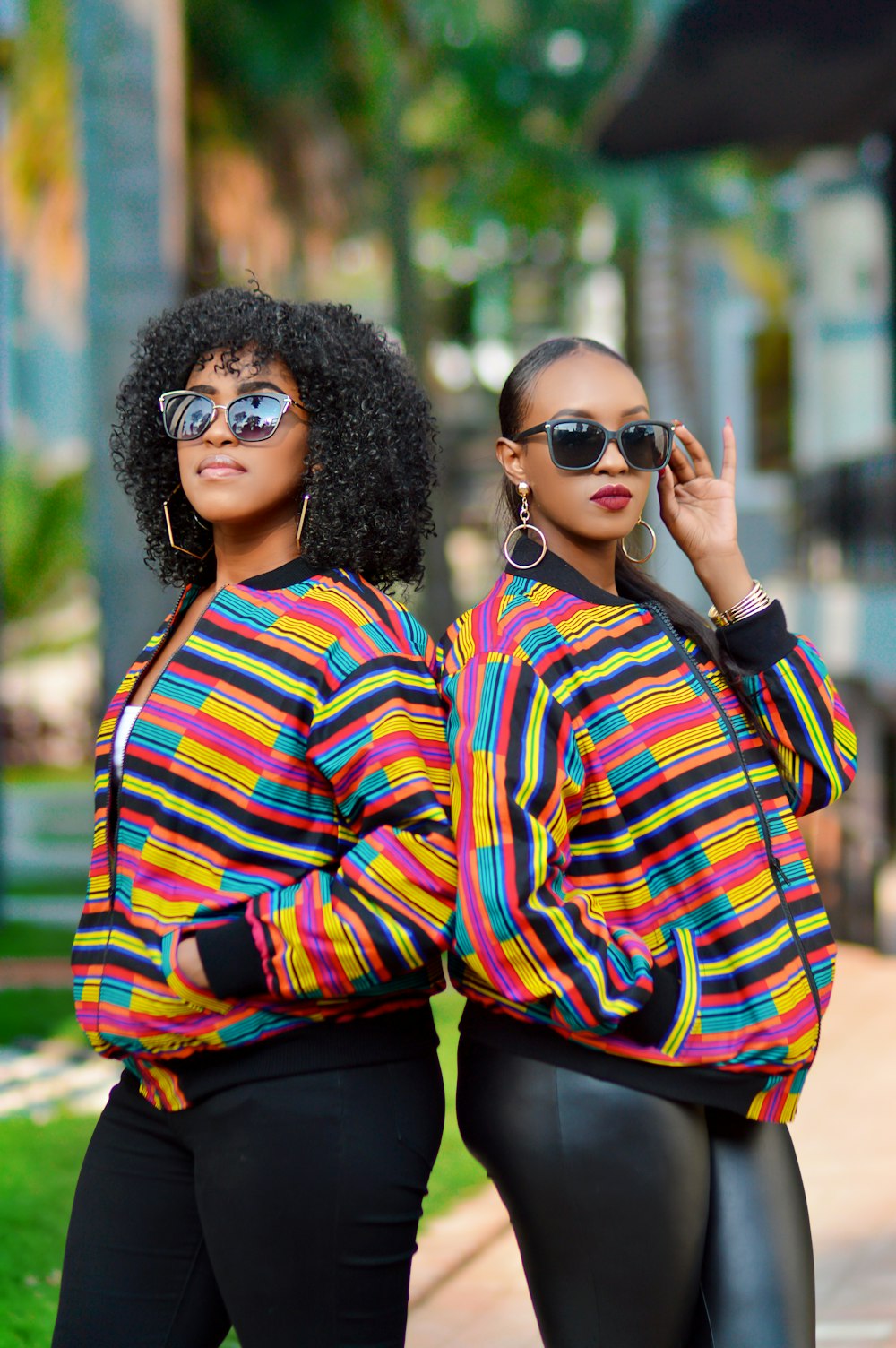 woman in red blue and yellow plaid dress shirt wearing black sunglasses