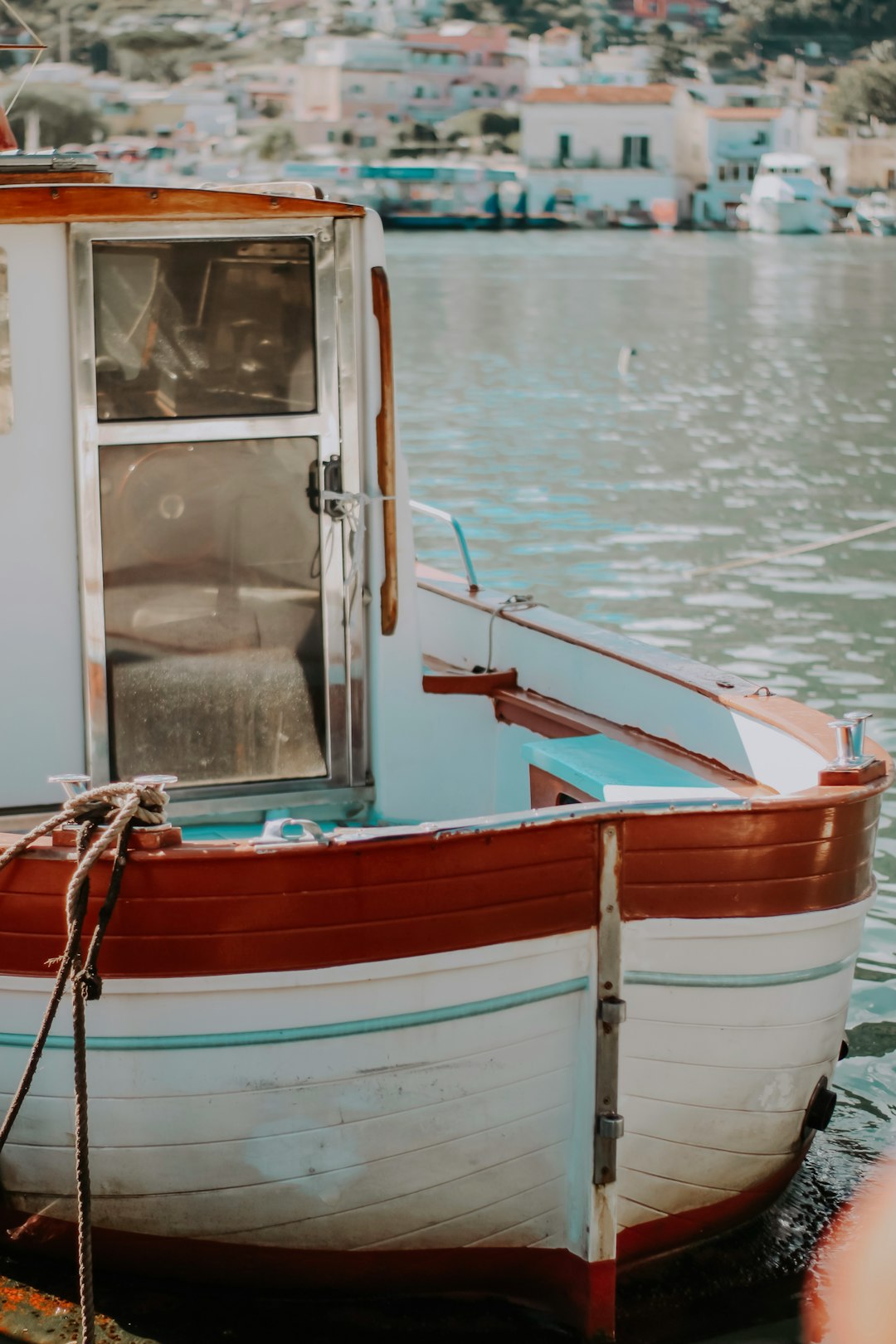 red and white boat on water during daytime