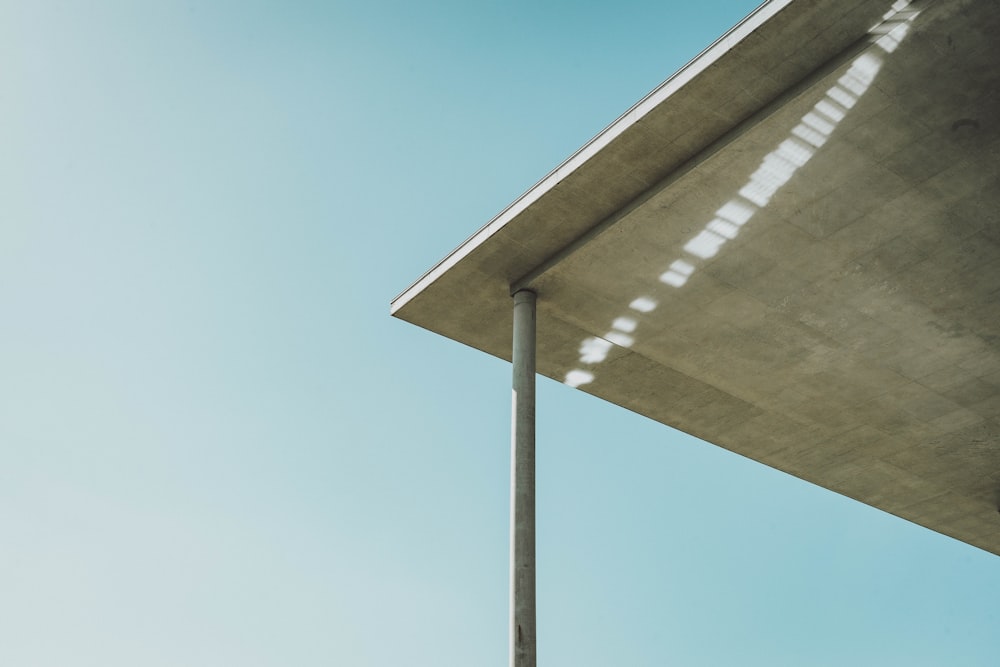 brown and white striped umbrella under blue sky during daytime