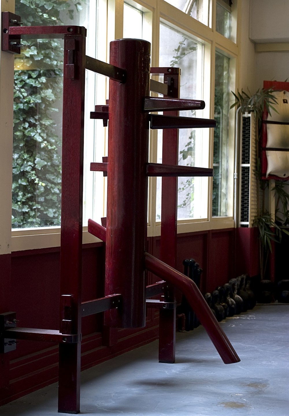 red wooden ladder near green trees during daytime