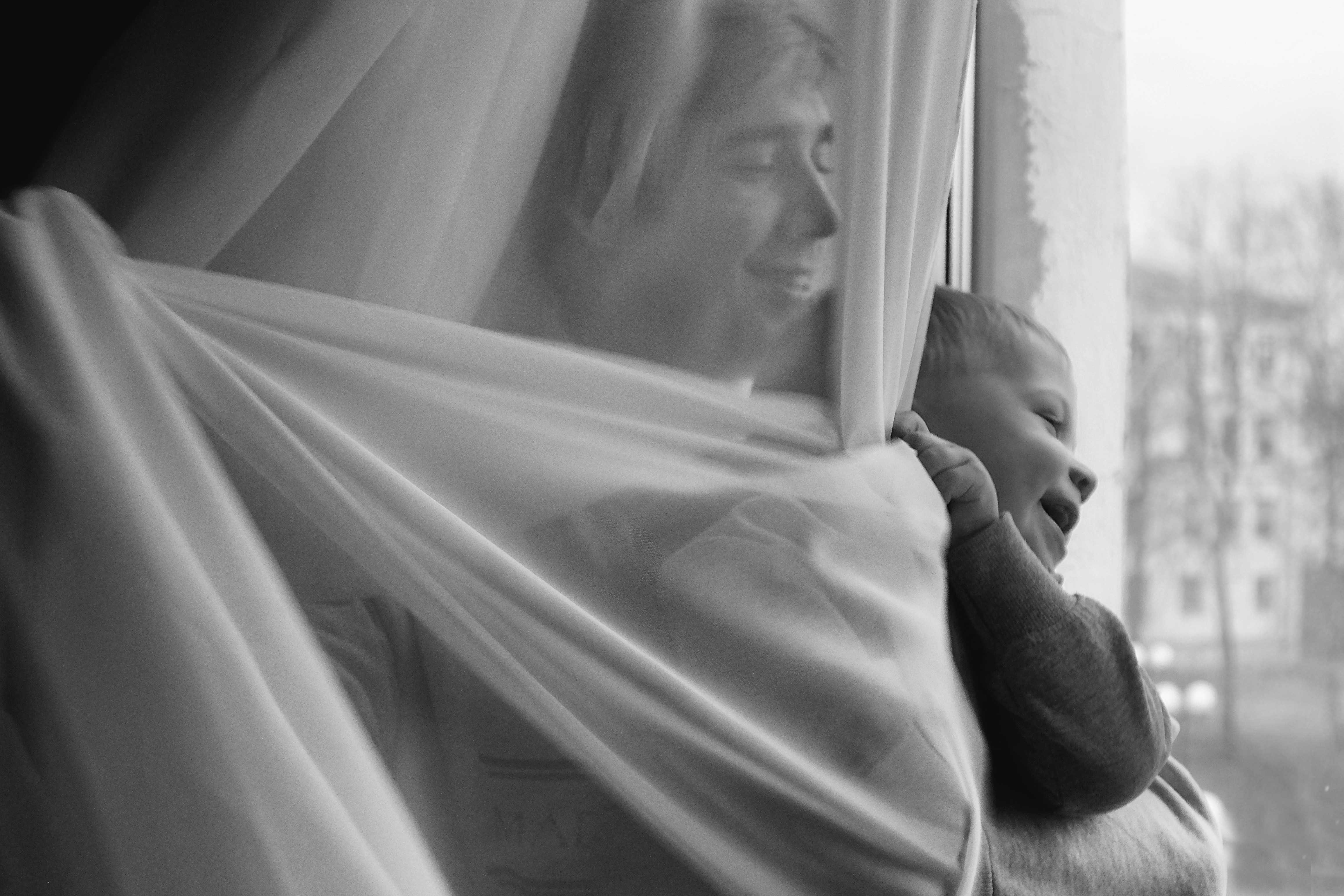 grayscale photo of man and woman kissing