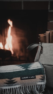 black leather armchair near fire