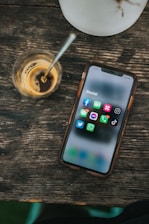 white samsung android smartphone on brown wooden table