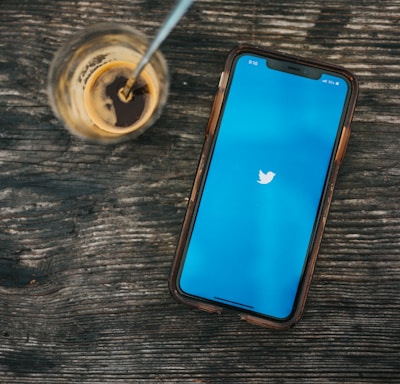 blue ipod touch on brown wooden table