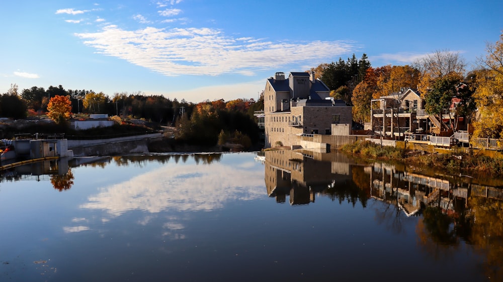 white concrete building near body of water during daytime