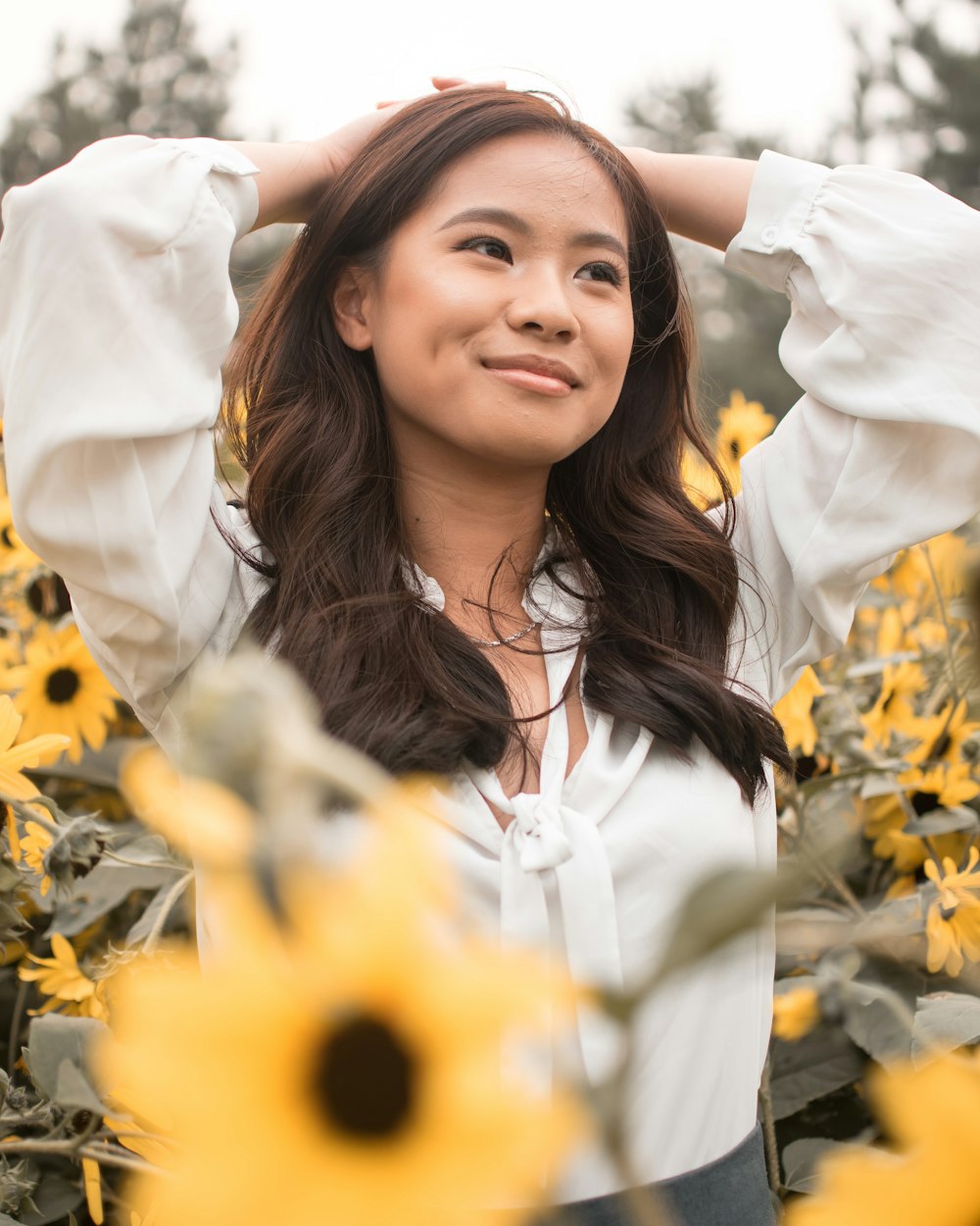 woman in white dress shirt smiling