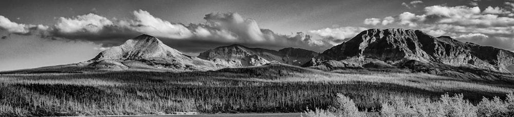 snow covered mountain under cloudy sky