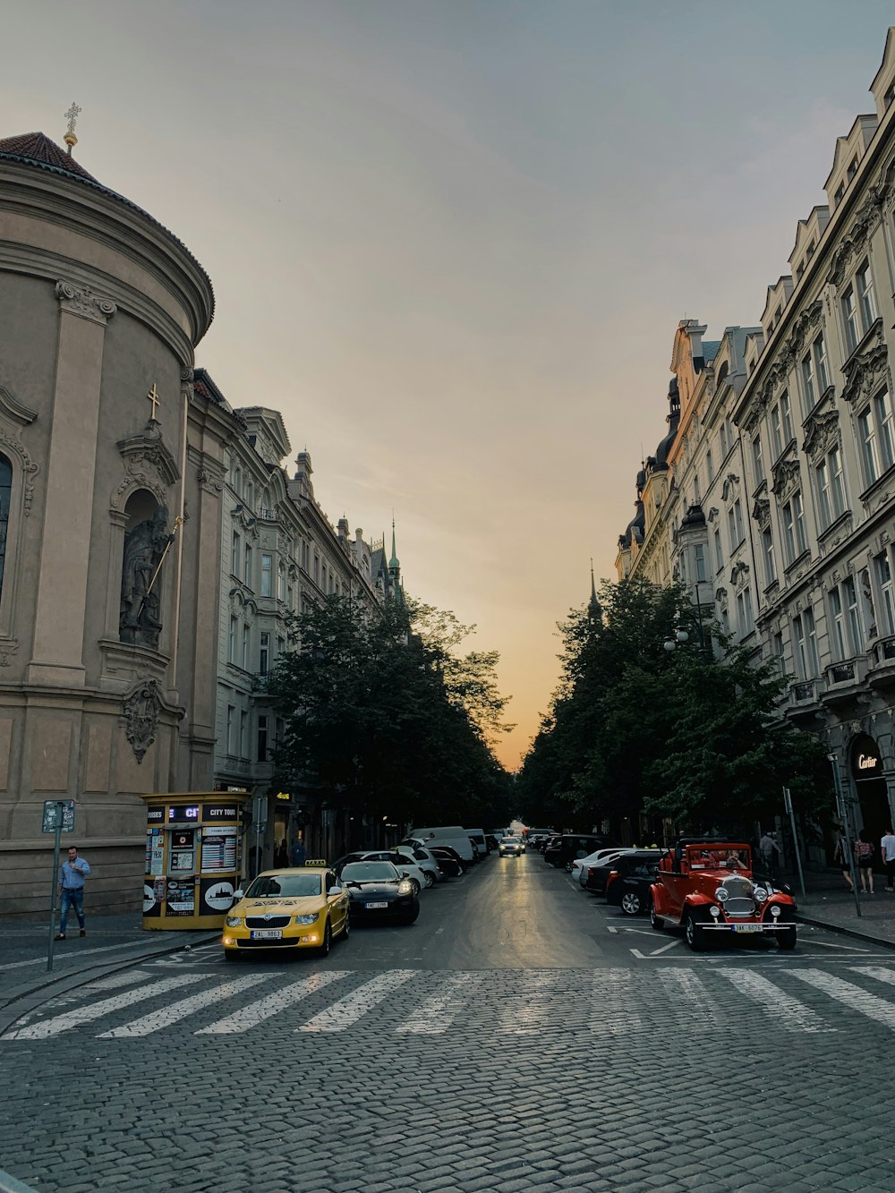 cars on road near building during daytime