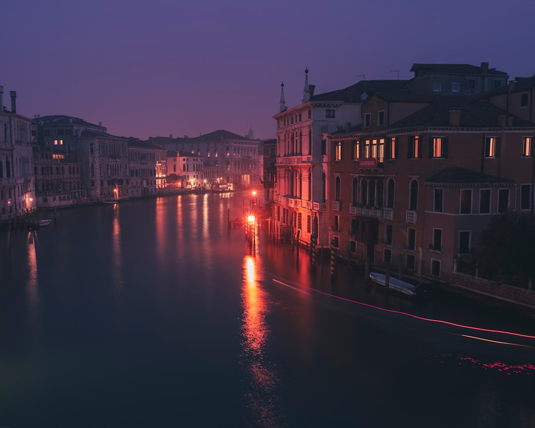 body of water between buildings during night time