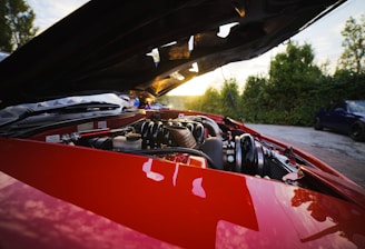 red and black car on road during daytime