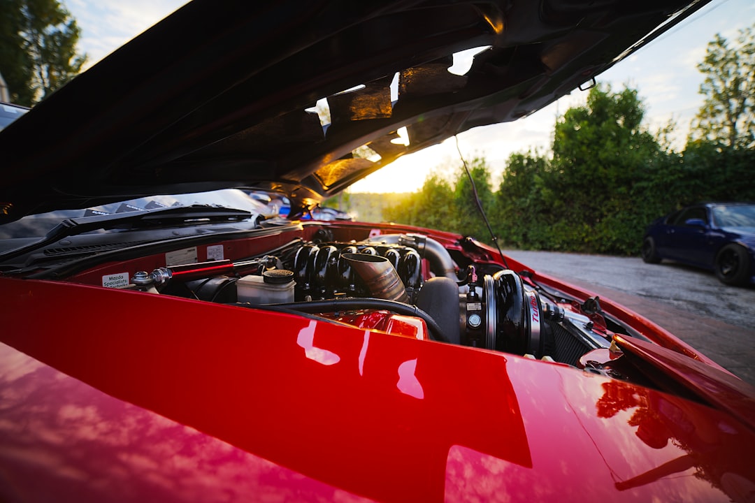 red and black car on road during daytime, Turbina al tramonto.