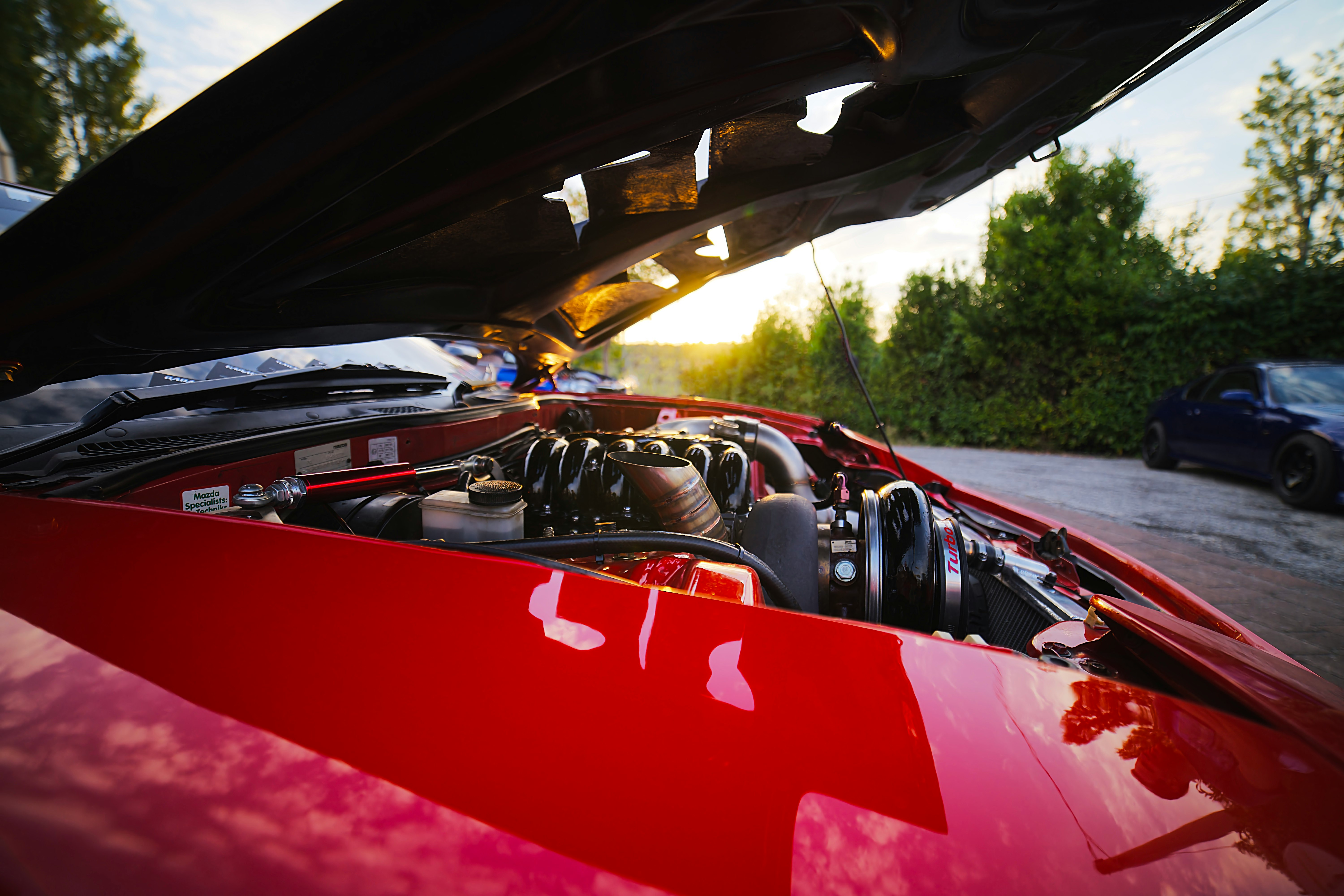 red and black car on road during daytime