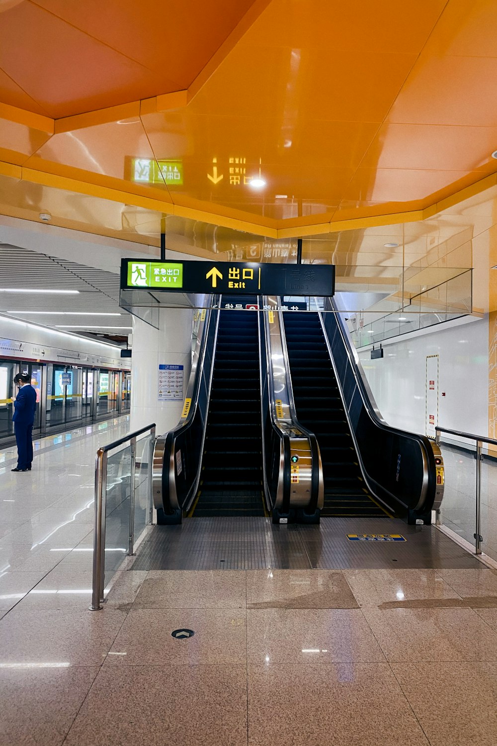 black escalator inside a building