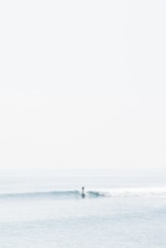 person surfing on sea waves during daytime