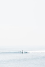 person surfing on sea waves during daytime