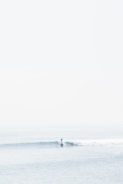 person surfing on sea waves during daytime