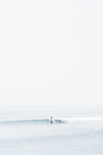 person surfing on sea waves during daytime