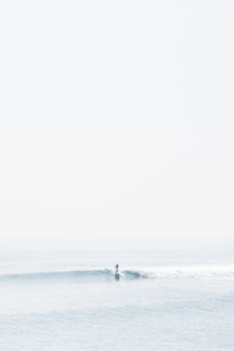person surfing on sea waves during daytime