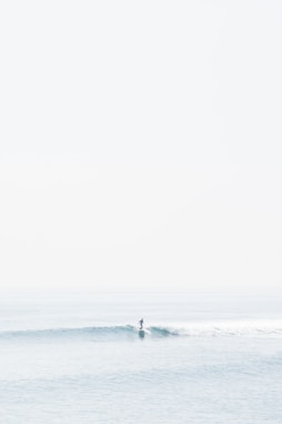 person surfing on sea waves during daytime