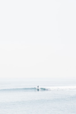 person surfing on sea waves during daytime