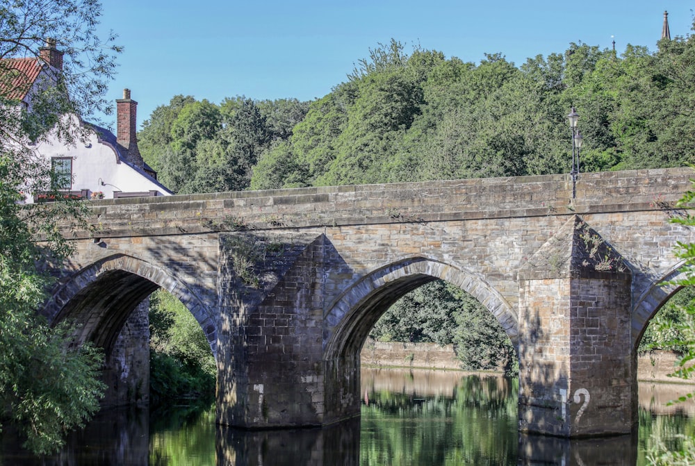 brown concrete bridge over river