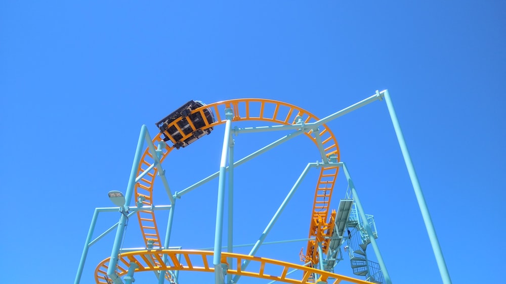 white and red ferris wheel under blue sky during daytime