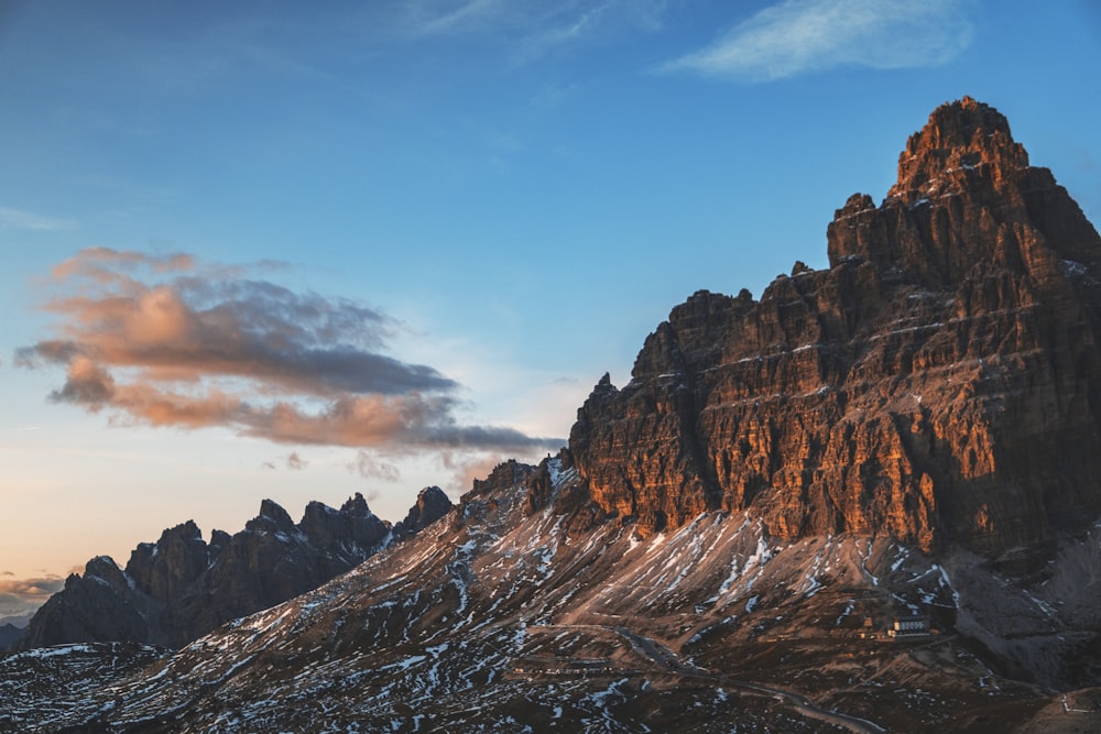 brown rocky mountain under blue sky during daytime