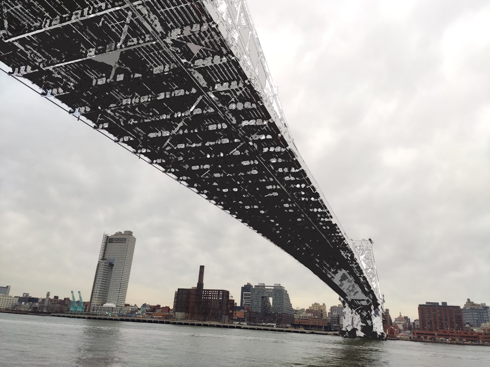 gray bridge over body of water during daytime