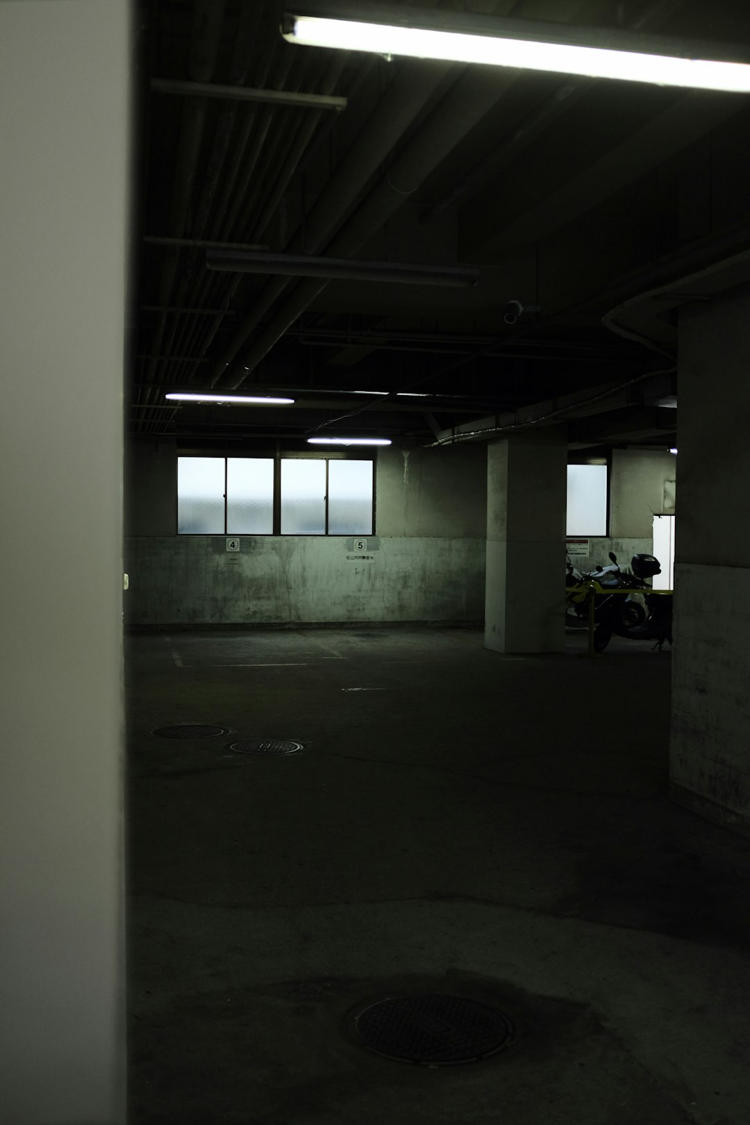 motorcycle parked in garage during daytime