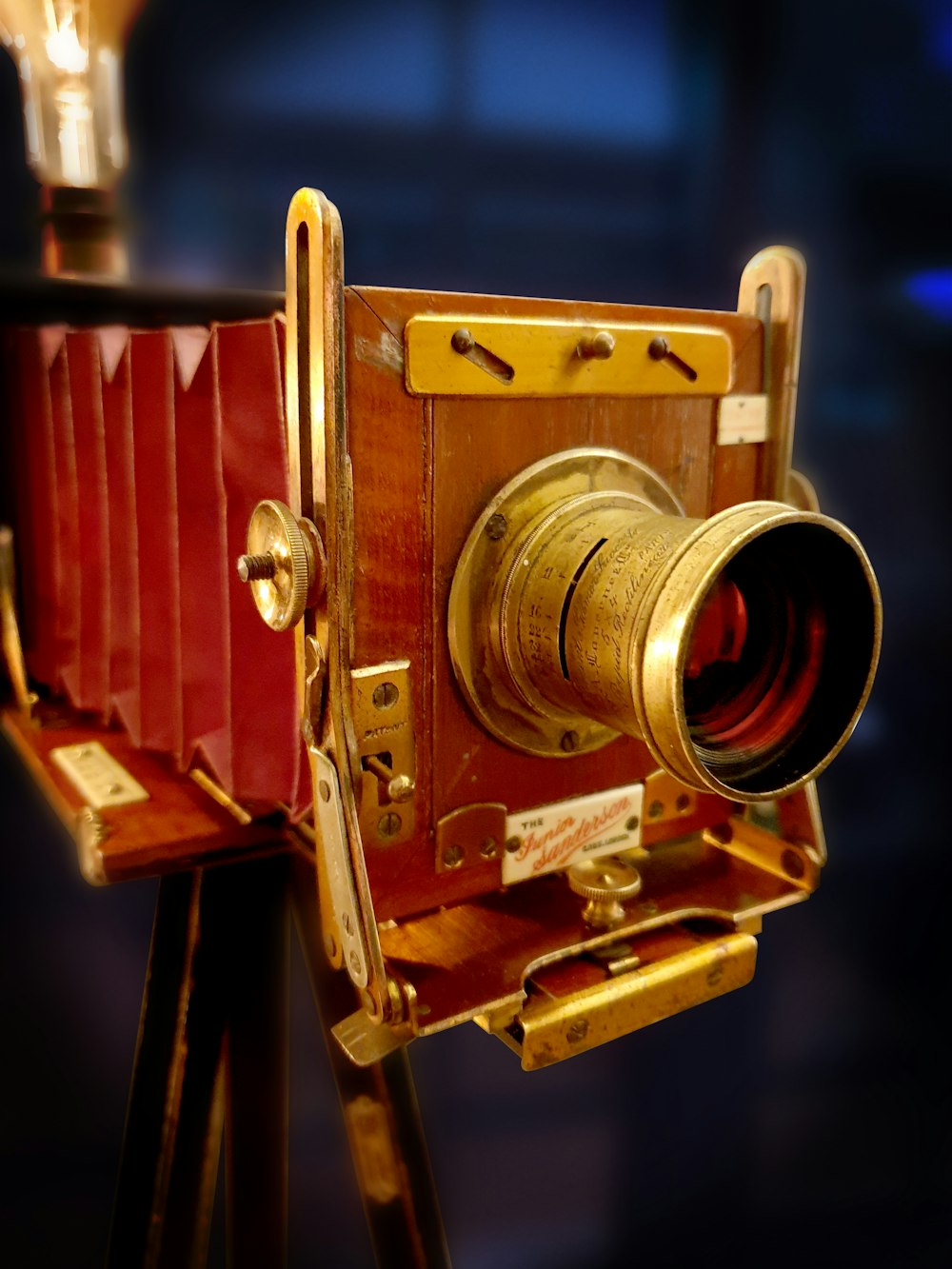 brown and silver camera on brown wooden table