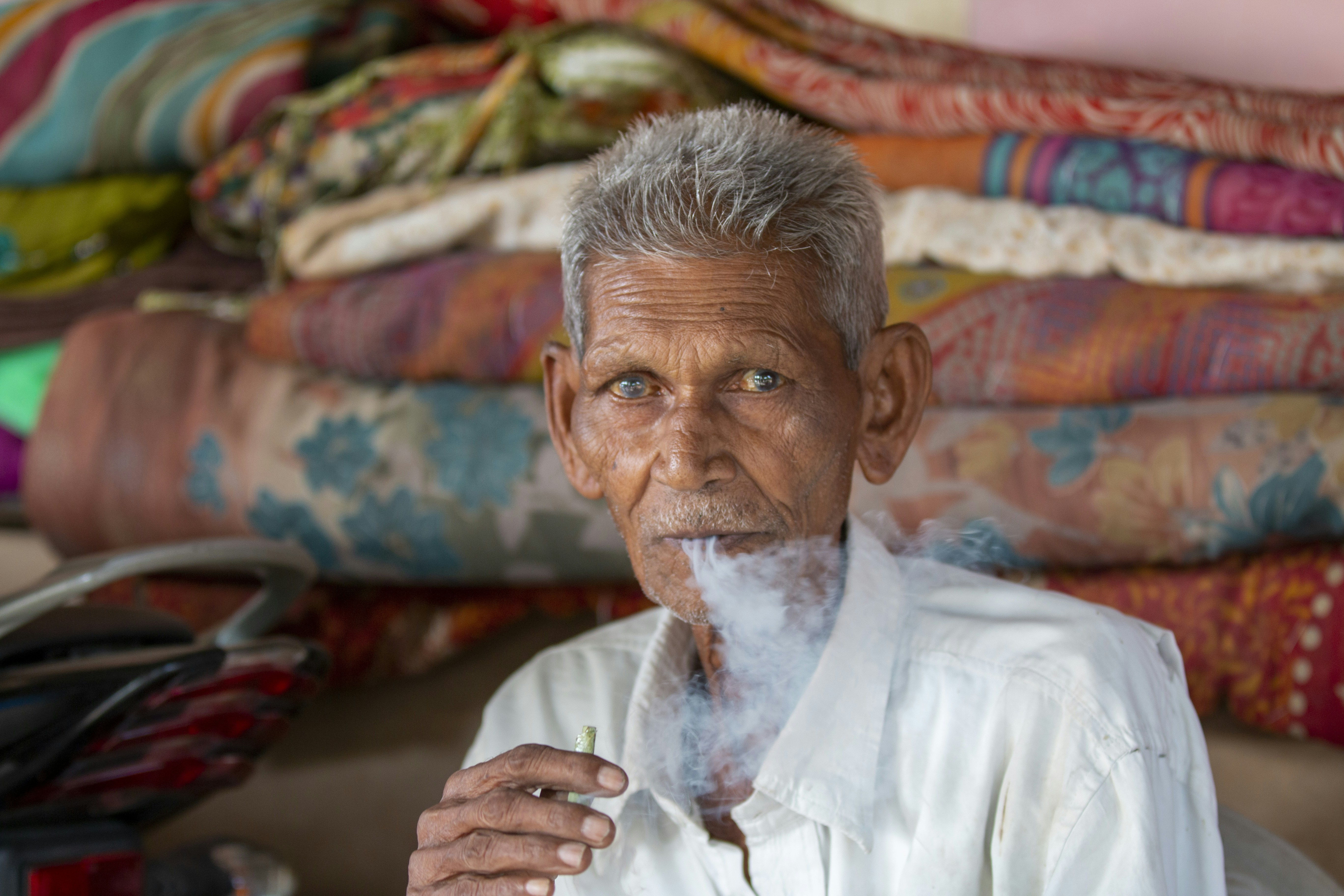 smoke-free tobacco product transformation business - man in white dress shirt sitting on couch