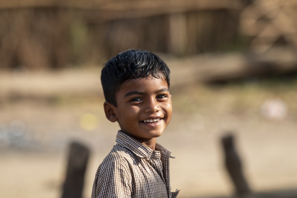 boy in black and white striped shirt