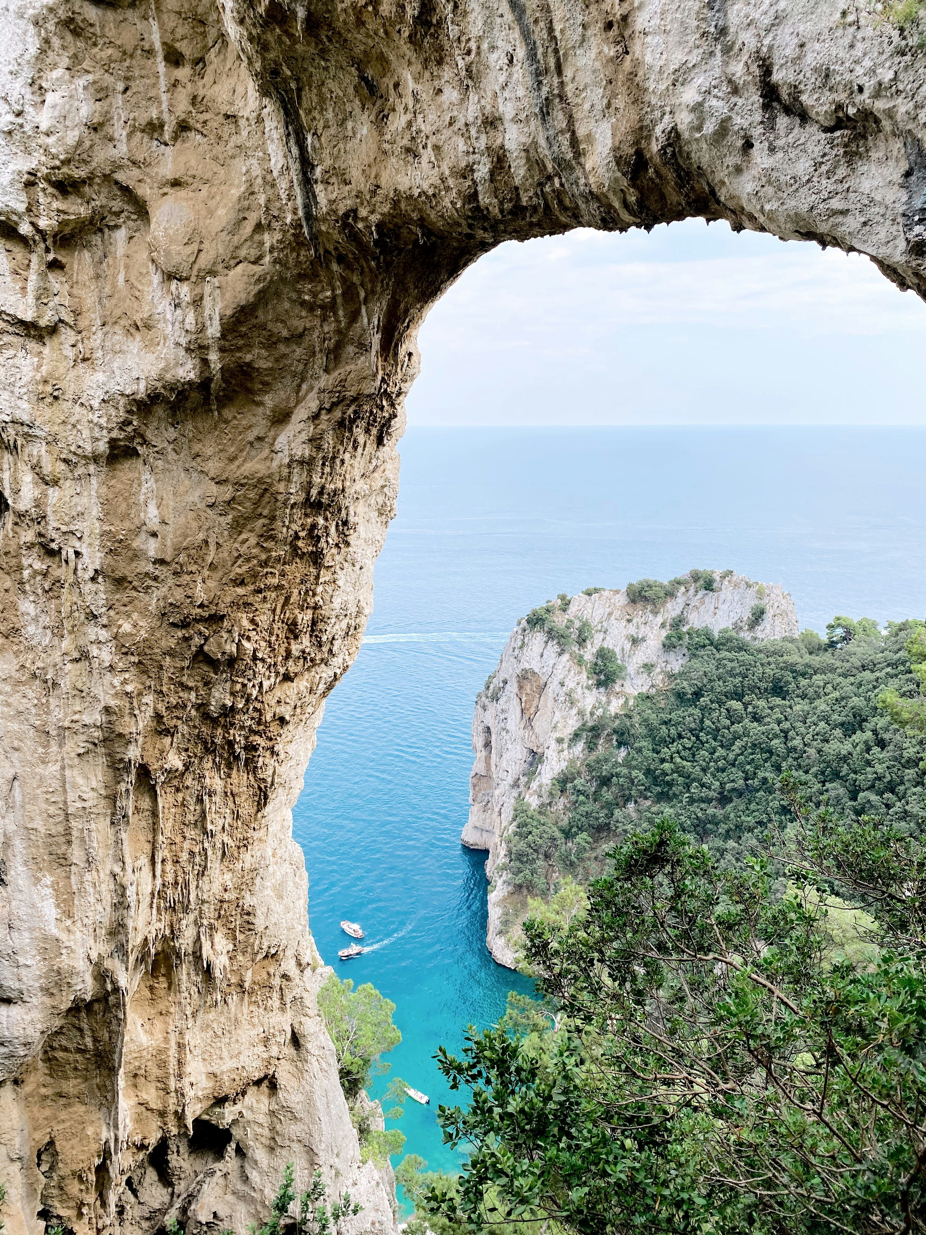 brown rock formation near blue sea during daytime