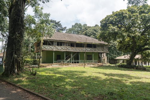 Dormitory building surrounded by lush green trees at the pesantren.