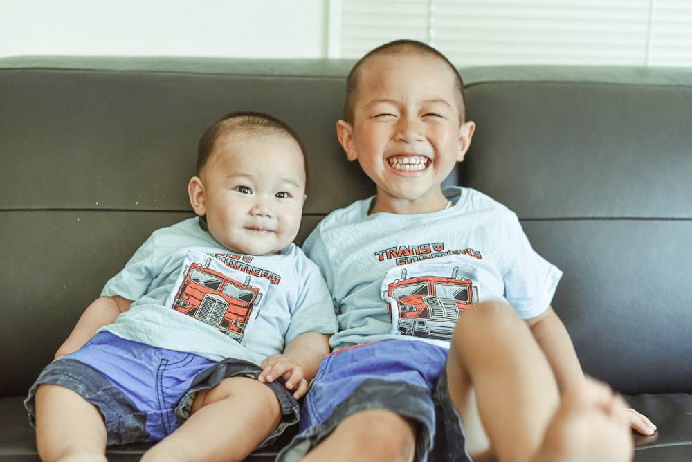 2 boys wearing white crew neck t-shirts