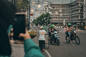 people riding motorcycle on road during daytime