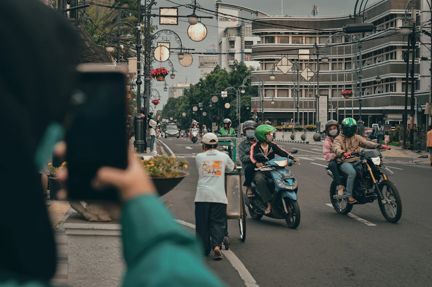 people riding motorcycle on road during daytime